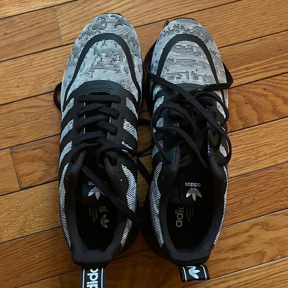 NWOT- Men’s Adidas sneakers. Never worn